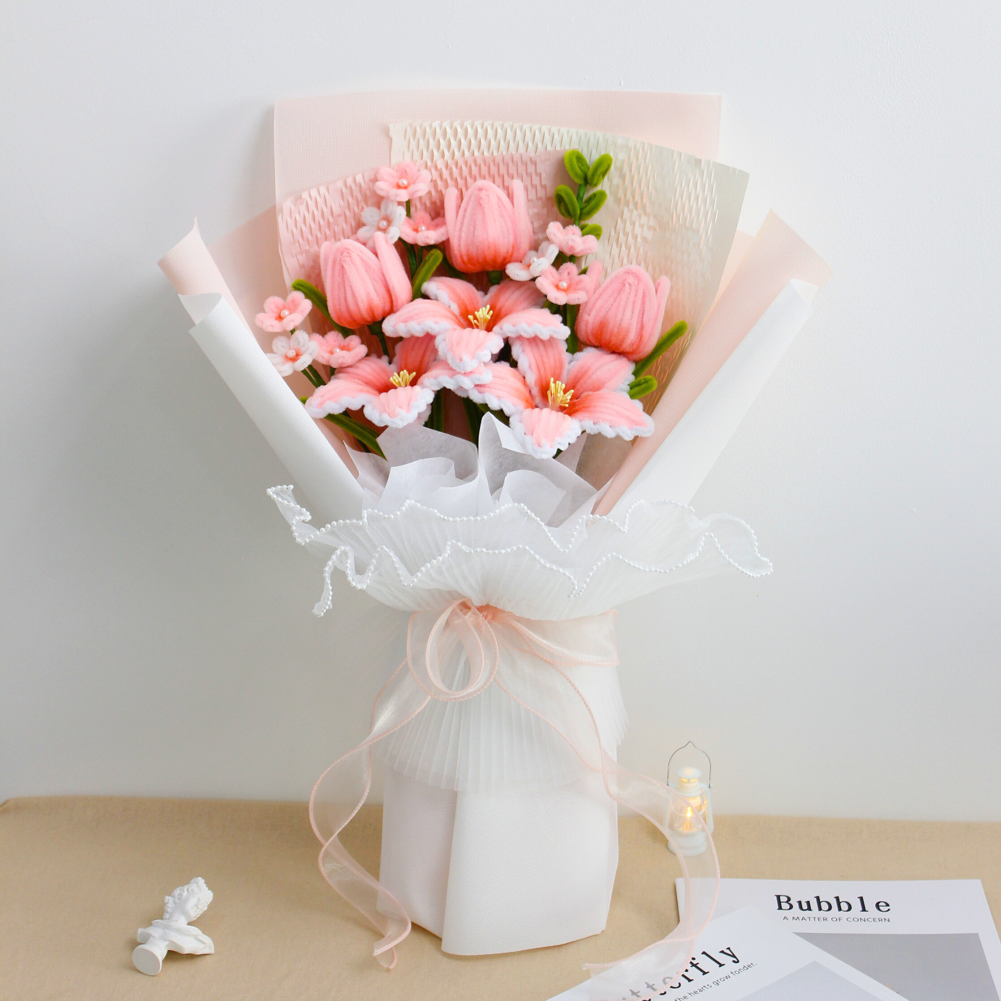 Cherish Tiger Lilies DIY bouquet featuring soft pink tiger lilies, tulips, and small blossoms made from pipe cleaners, wrapped in layered pastel pink and white paper.