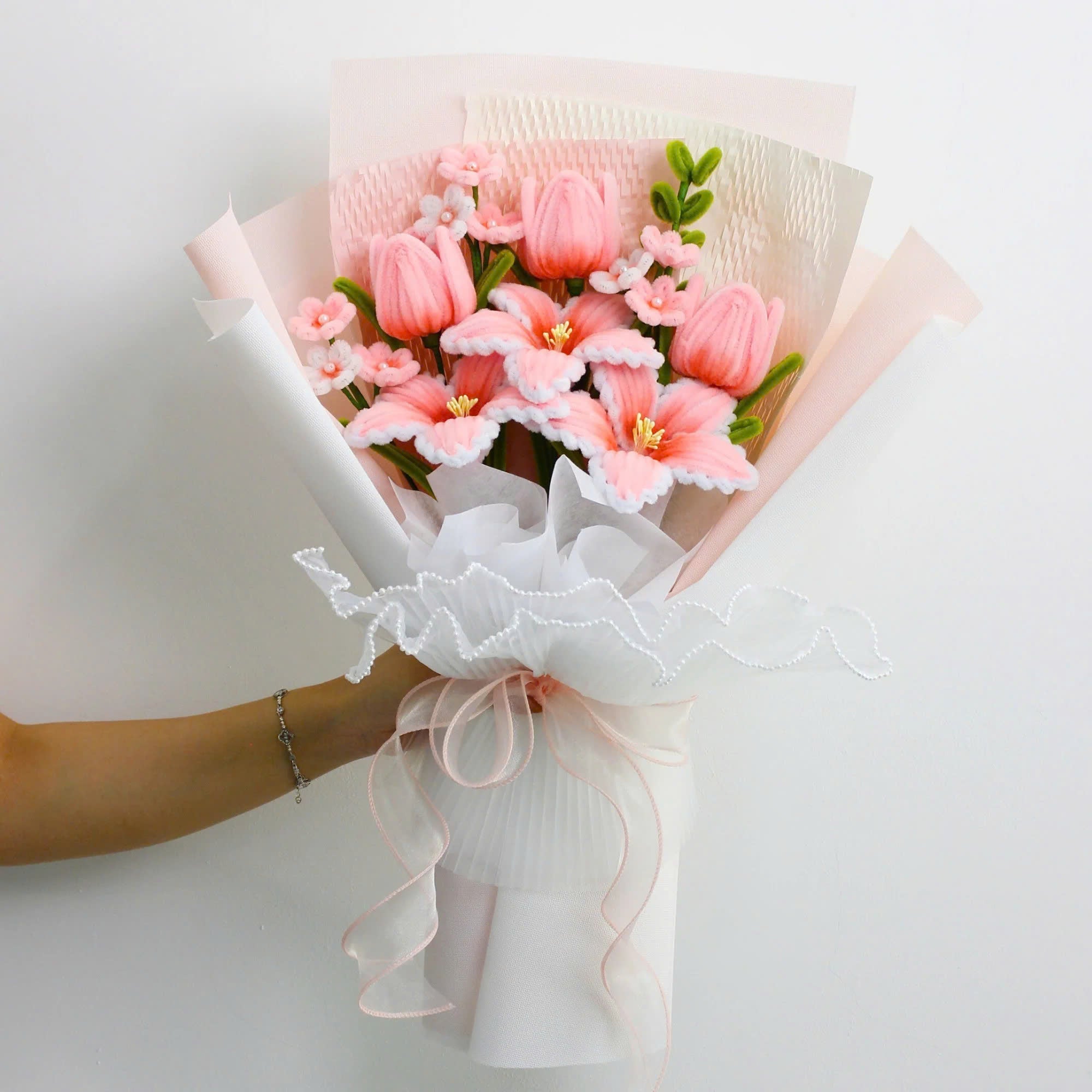 Cherish Tiger Lilies DIY bouquet featuring soft pink tiger lilies, tulips, and small blossoms made from pipe cleaners, wrapped in layered pastel pink and white paper.