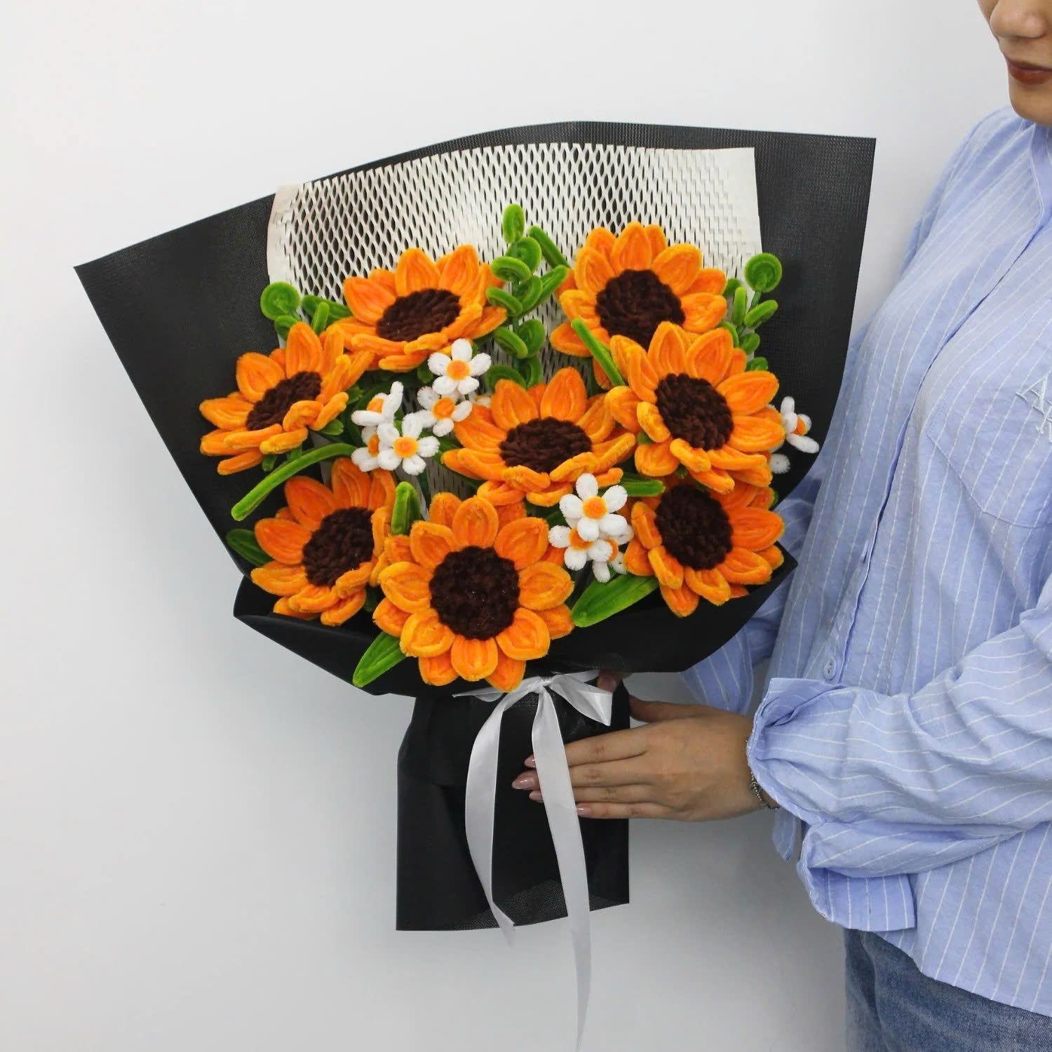 Golden Hour DIY sunflower bouquet made from vibrant orange pipe cleaners, featuring handmade daisies and lush green stems. Wrapped in black mesh and paper for a bold, elegant contrast ideal for DIY lovers and heartfelt handmade gifts.