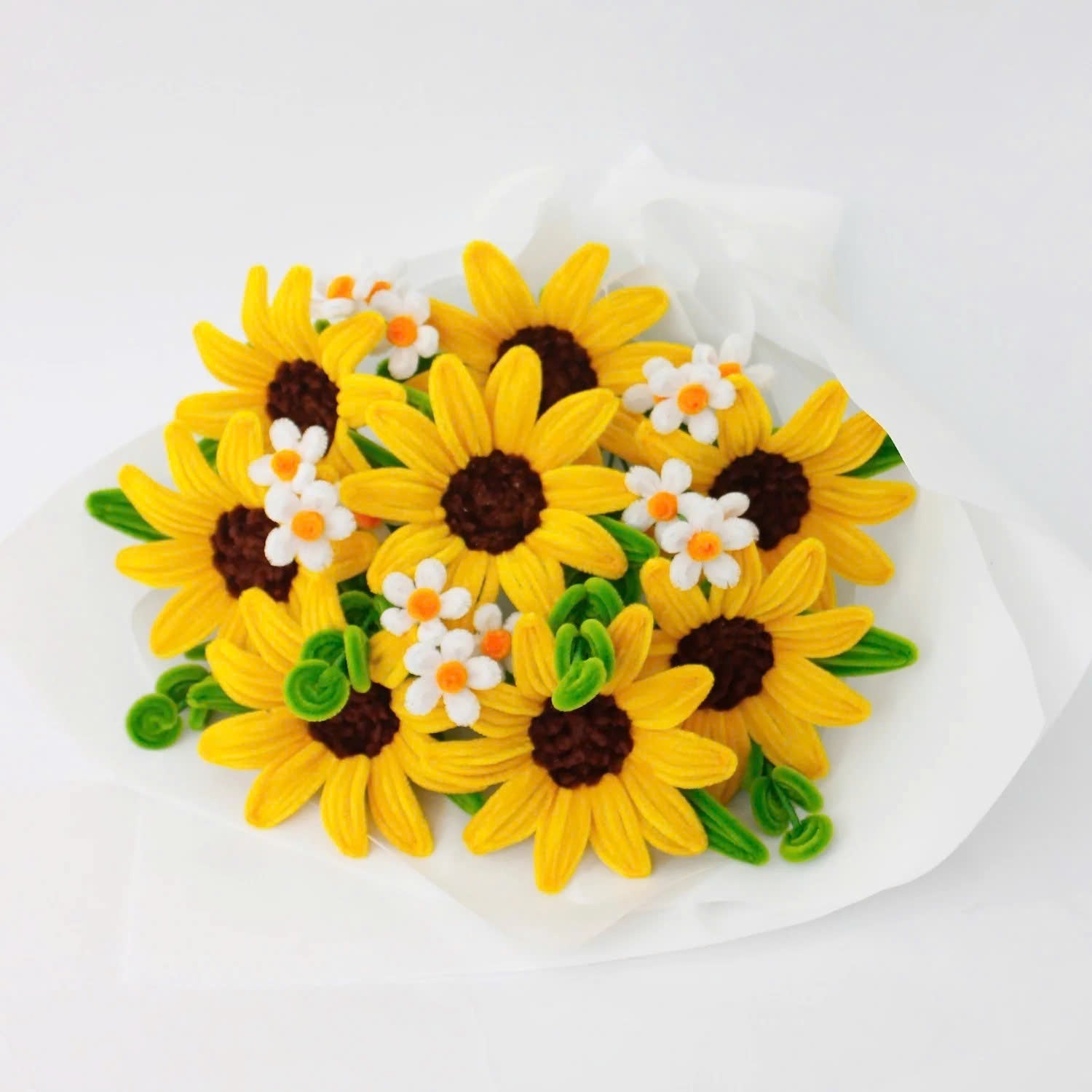Honey Glow DIY bouquet featuring bright yellow sunflowers and small white daisies made from pipe cleaners, wrapped in soft white paper.