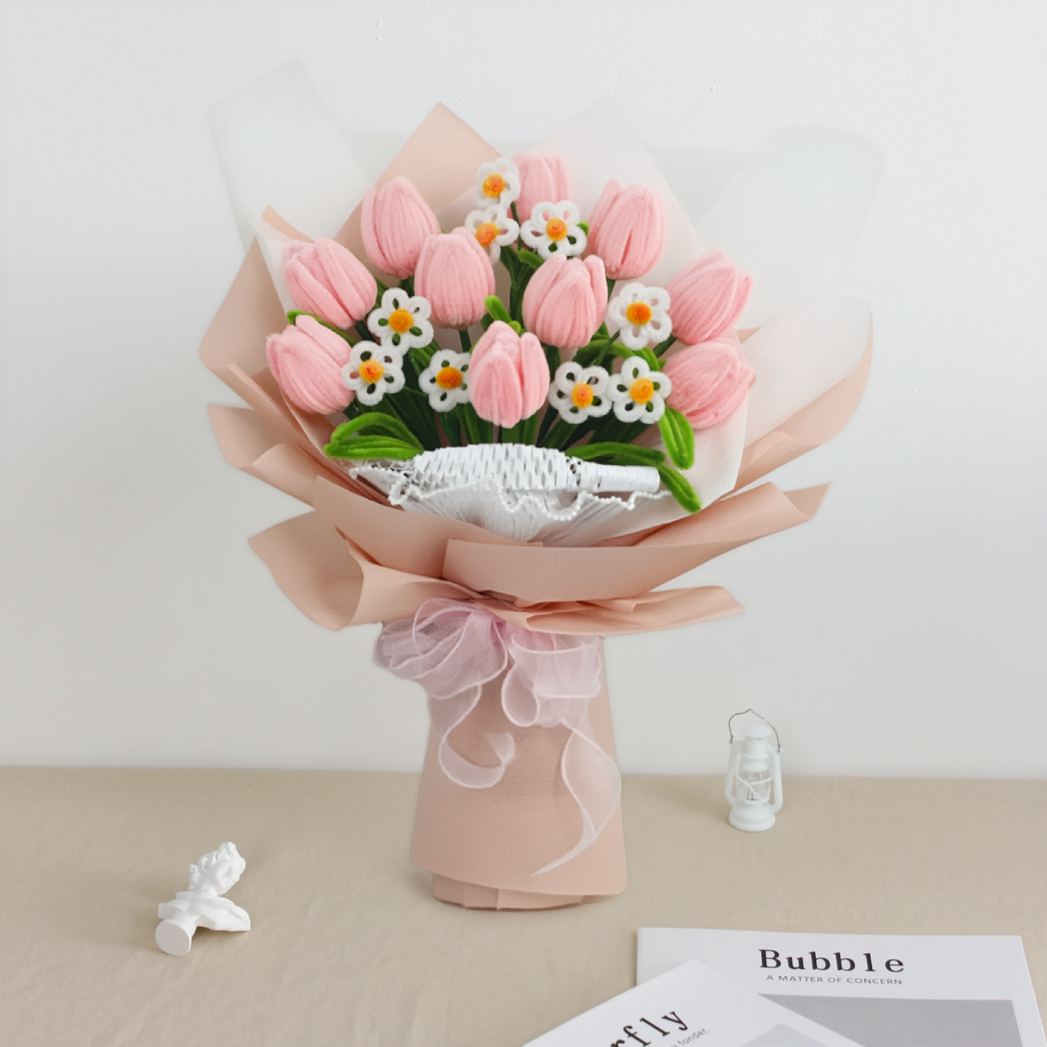 Sweet Blossoms DIY bouquet featuring soft pink tulips and white daisies made from pipe cleaners, wrapped in blush pink paper with a sheer ribbon.