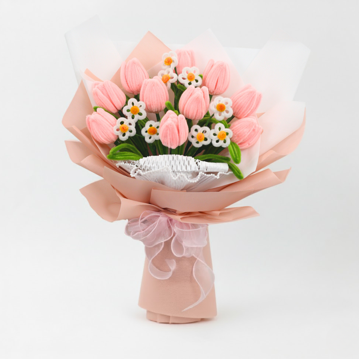 Sweet Blossoms DIY bouquet featuring soft pink tulips and white daisies made from pipe cleaners, wrapped in blush pink paper with a sheer ribbon.