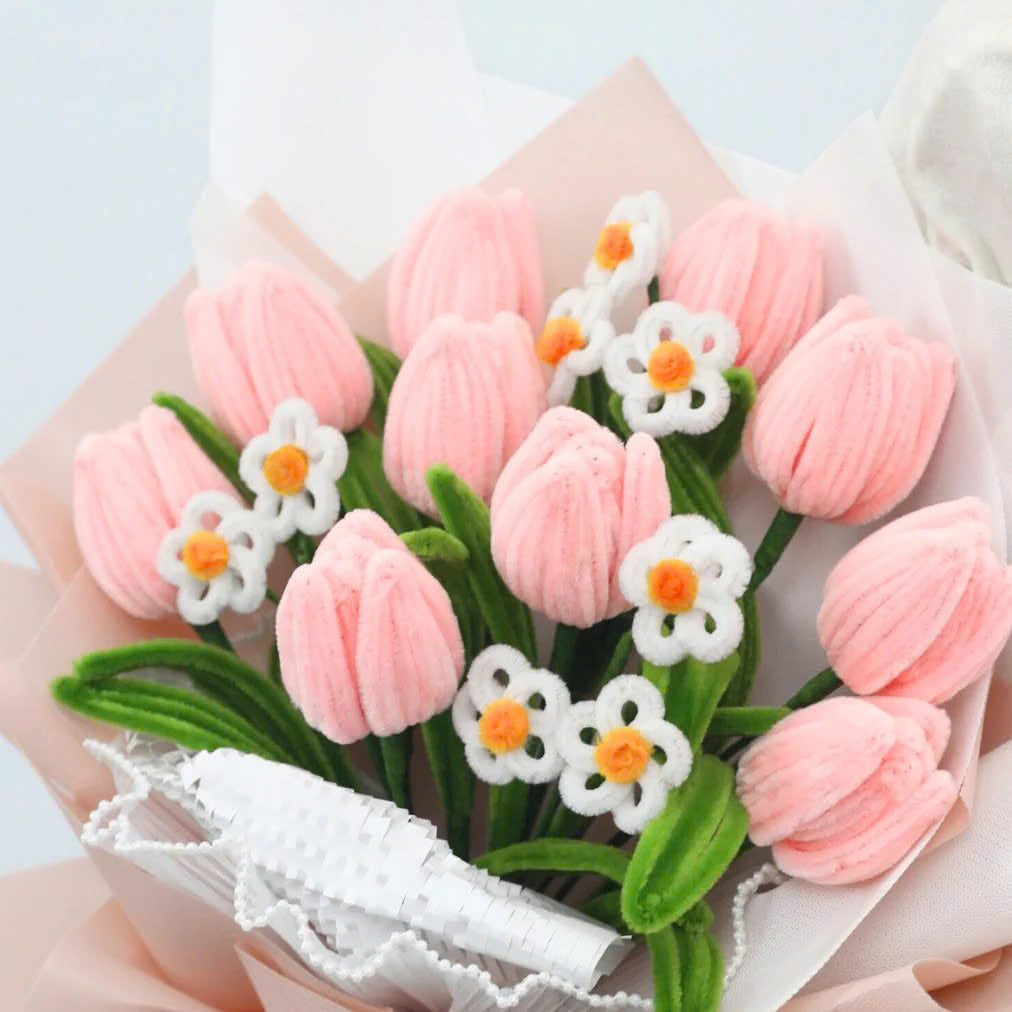Sweet Blossoms DIY bouquet featuring soft pink tulips and white daisies made from pipe cleaners, wrapped in blush pink paper with a sheer ribbon.