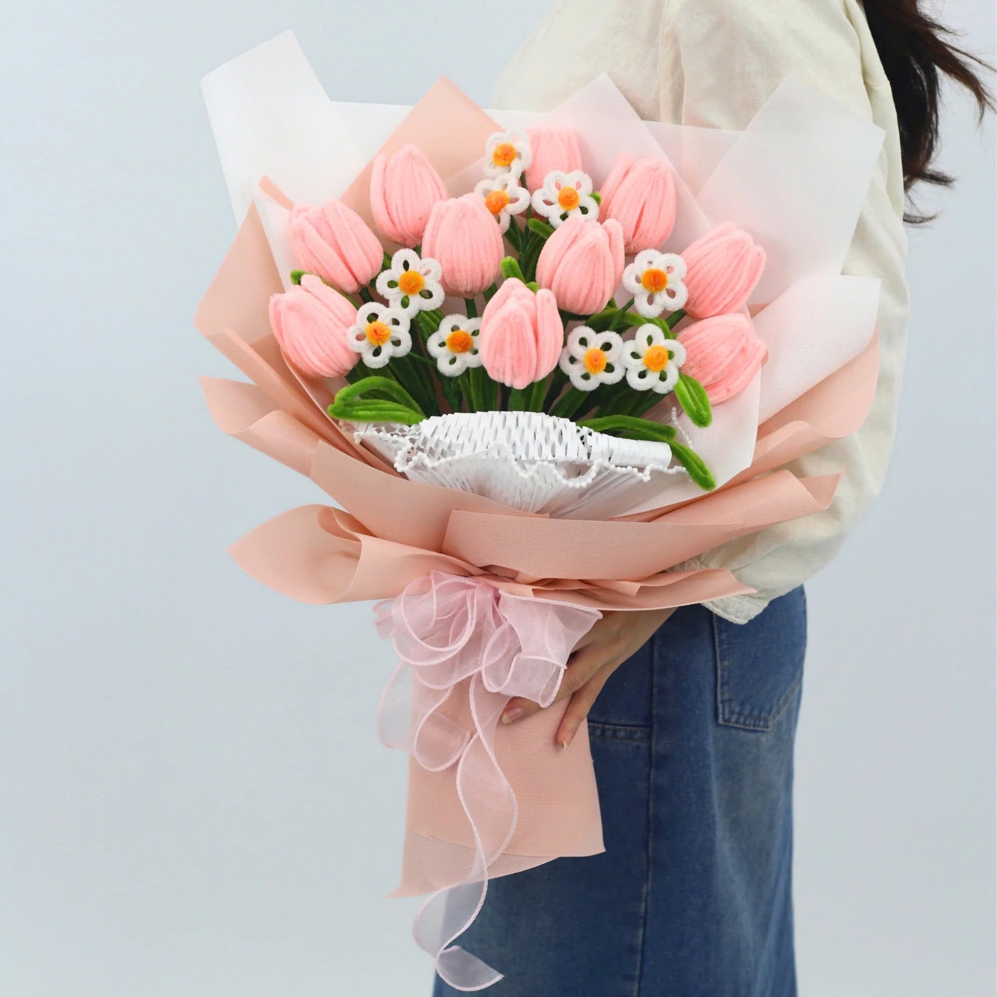 Sweet Blossoms DIY bouquet featuring soft pink tulips and white daisies made from pipe cleaners, wrapped in blush pink paper with a sheer ribbon.